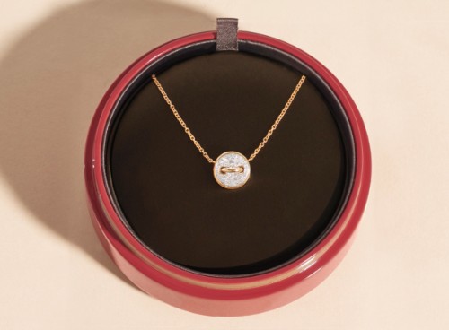 open gift box with a necklace inside